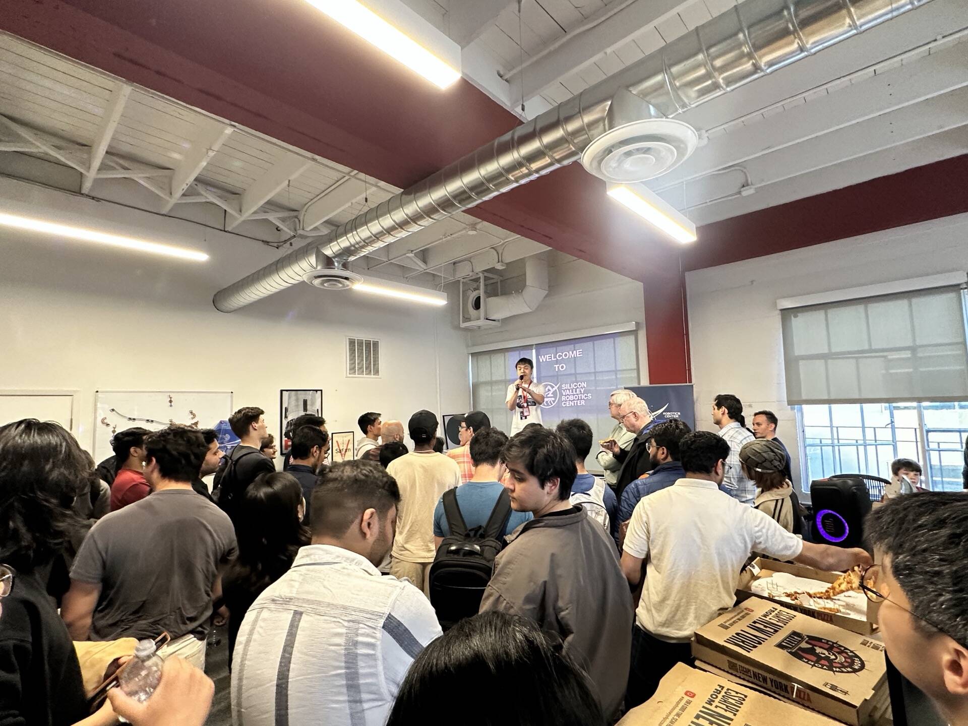 Standing room crowd at SVRC May 8 meetup — Welcome to Robotics Center of Silicon Valley banner